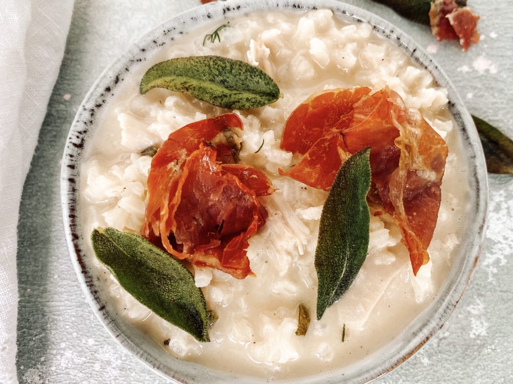 Photograph of Chicken Risotto with Crispy Sage and Prosciutto
