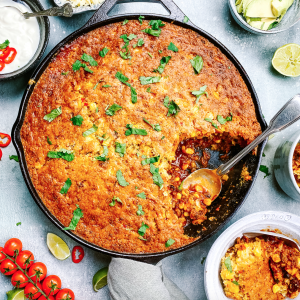 Photograph of Chilli Topped with Cornbread, Red Onion, Red Pepper, Red Chilli and Garlic