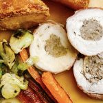 Photograph of Chicken Breast Roast Dinner with Sausages, Roast Potatoes, Roast Carrots, Shredded Brussels Sprouts and Gravy