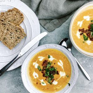 Photograph of Cream of Roast Butternut Squash Soup with Garlic Confit, Ginger and Chilli