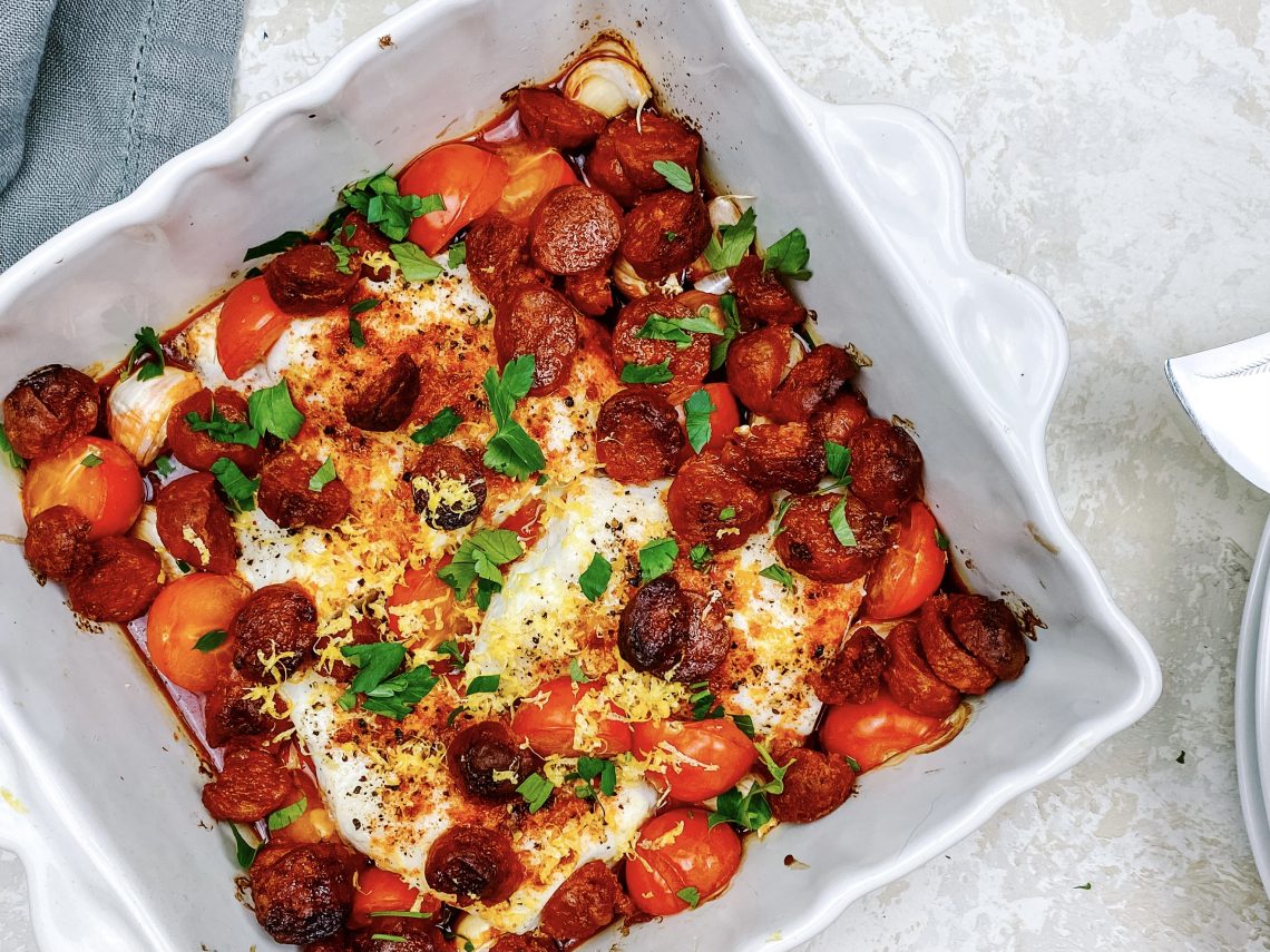 Photograph of Smoked Paprika Baked Hake with Chorizo, Lemon, Tomatoes and Garlic