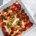 Photograph of Smoked Paprika Baked Hake with Chorizo, Lemon, Tomatoes and Garlic