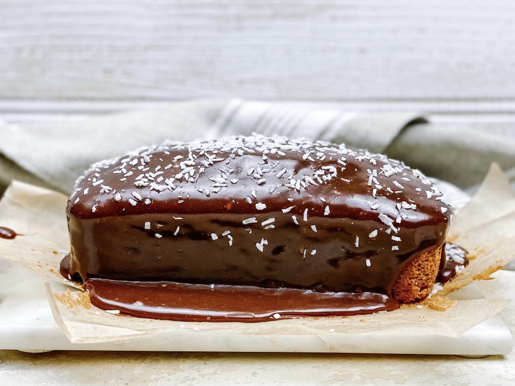 Photograph of Coconut Loaf Cake with Salted Milk Chocolate Ganache