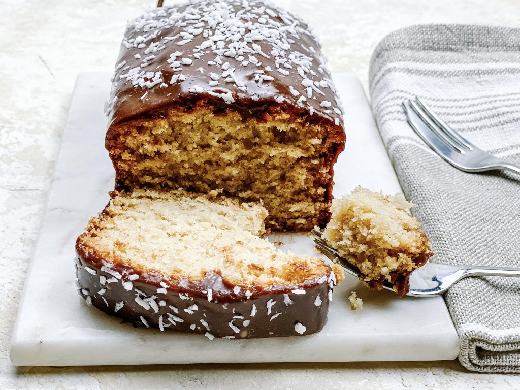 Photograph of Coconut Loaf Cake with Salted Milk Chocolate Ganache