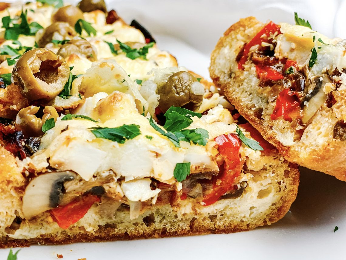 Photograph of Olive Ciabatta Loaded with Red Pepper, Mushrooms and Feta Cheese