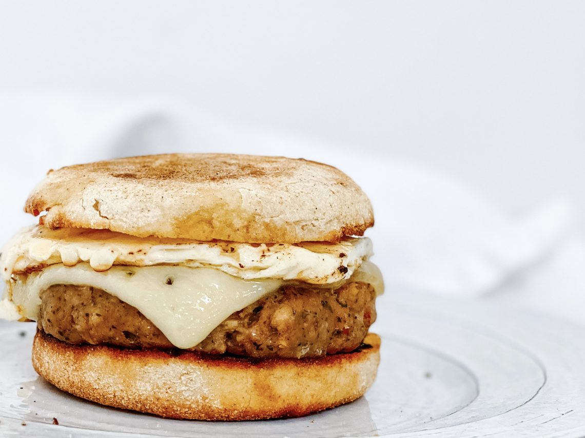 Photograph of 'Wimbledon Royals' Sausage and Egg English Muffin with Cheese