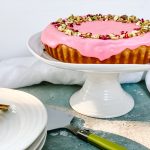 Photograph of Pistachio and Cherry Bakewell Tart with Pink Rose Water Icing