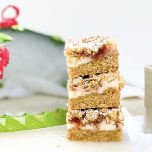 Photograph of Strawberries and Cream Oat Crumble Cheesecake Slices