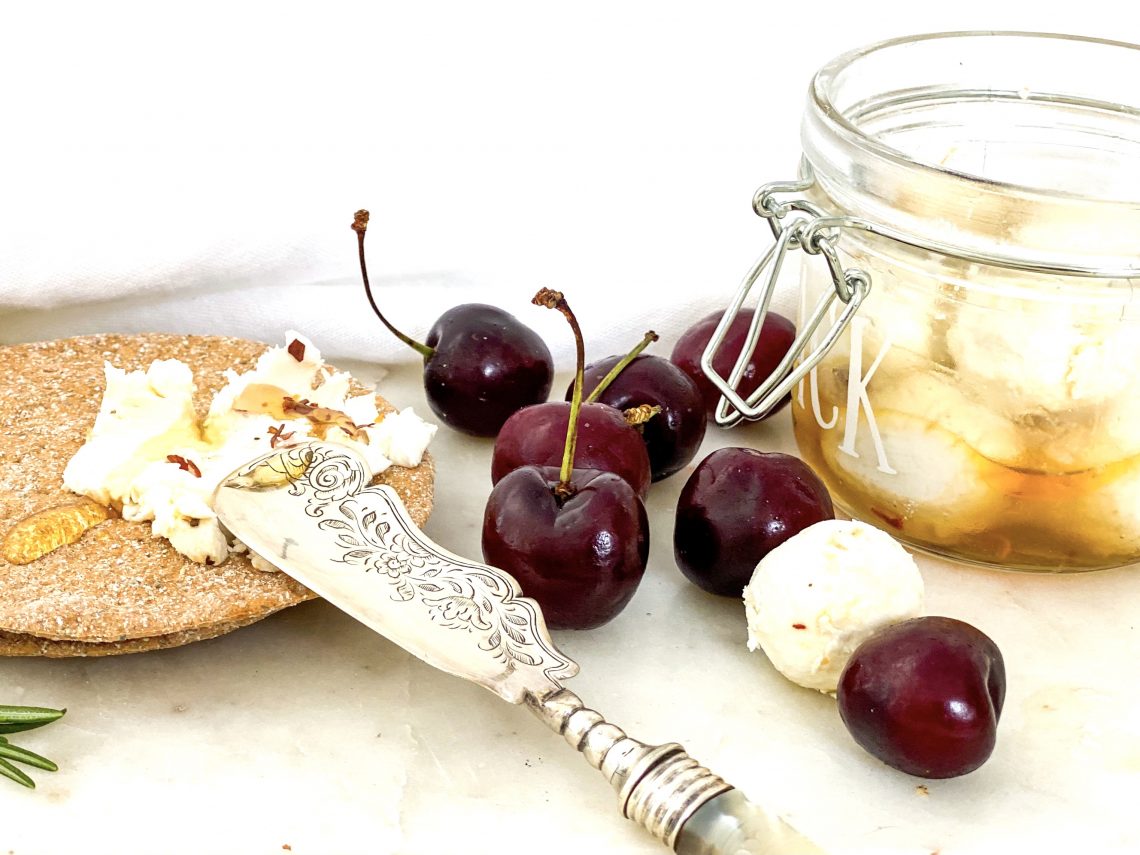 Photograph of Goats Cheese Balls with Rosemary and Chilli Honey and Fresh Cherries.