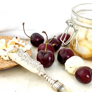 Photograph of Goats Cheese Balls with Rosemary and Chilli Honey and Fresh Cherries.