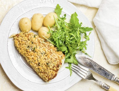 Photograph of Haddock with Semi-dried Tomato Pesto and a Crispy Lemon and Basil Breadcrumb Topping.