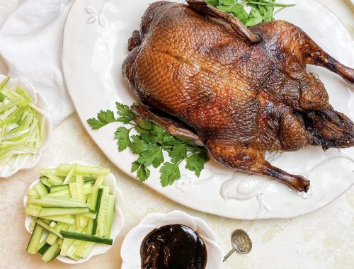 Photograph of Chinese Peking Duck Pancakes with Hoisin Sauce, Spring Onions and Cucumber