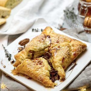 Photograph of Camembert Baked in Puff Pastry and Served with Roast Pecan Nuts and Chilli Honey