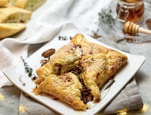 Photograph of Camembert Baked in Puff Pastry and Served with Roast Pecan Nuts and Chilli Honey