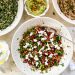 Photograph of Warm Sweet Potato and Chickpea Salad with Feta Cheese, Fresh Herbs and Pomegranate