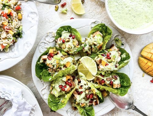 Photograph of Platinum Jubilee Chicken Tikka with a Curried Mayonnaise and Yoghurt Sauce, Fresh Mango, Pomegranate Seeds and Pistachio