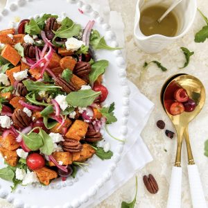 Photograph of Roast Sweet Potato, Fresh Cherry and Goat's Cheese Salad with Cranberries, Pecan Nuts and Pickled Red Onion