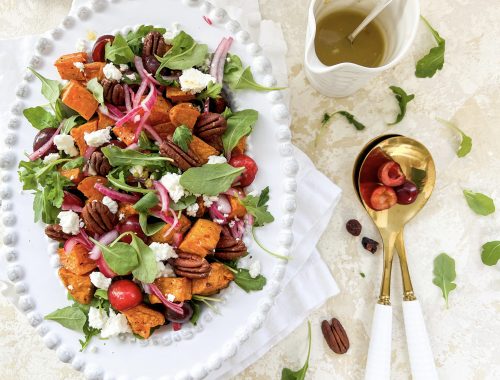 Photograph of Roast Sweet Potato, Fresh Cherry and Goat's Cheese Salad with Cranberries, Pecan Nuts and Pickled Red Onion