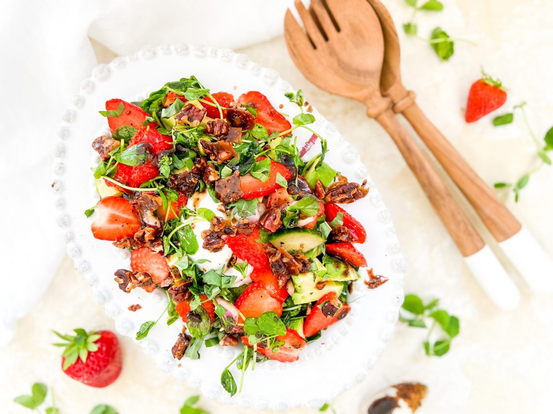 Photograph of Strawberry and Avocado Salad with Burrata, Salted Caramel Pecan Nuts and a Balsamic Dressing with Honey and Poppy Seeds