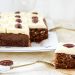 Photograph of Loaded Carrot Cake Slice with a Sweetened Cream Cheese Topping