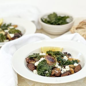 Photograph of Roast Kohlrabi, King Oyster Mushrooms and Artichokes, served with Crispy Kale and Crumbled Feta, drizzled with a Chilli, Garlic Brown Butter