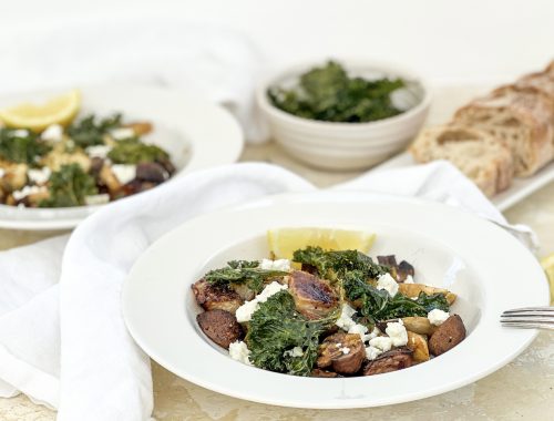 Photograph of Roast Kohlrabi, King Oyster Mushrooms and Artichokes, served with Crispy Kale and Crumbled Feta, drizzled with a Chilli, Garlic Brown Butter