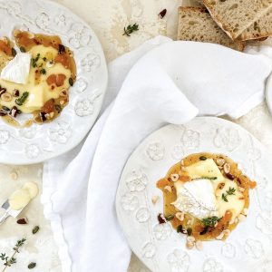 Photograph of Baked Camembert, Roast Pecans and Hazelnuts, Apricot, Chilli and Thyme Honey