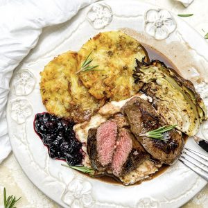 Photograph of Pan-fried Venison Fillet, Red Wine Jus and Macerated Blueberries