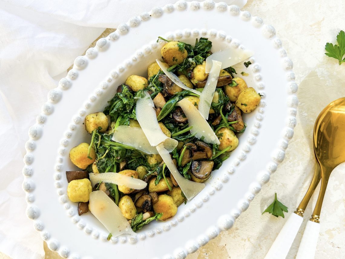 Photograph of Roast Gnocchi and Mushrooms with Wilted Spinach and Roast Garlic Parsley Butter