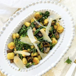 Photograph of Roast Gnocchi and Mushrooms with Wilted Spinach and Roast Garlic Parsley Butter