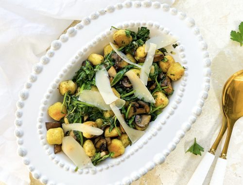 Photograph of Roast Gnocchi and Mushrooms with Wilted Spinach and Roast Garlic Parsley Butter