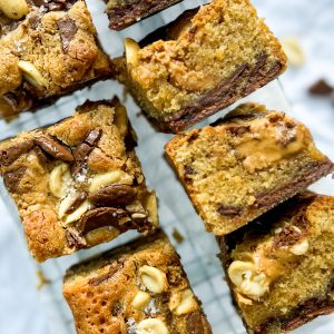 Photograph of Chocolate Chunk Peanut Butter Blondies with Salted Peanuts