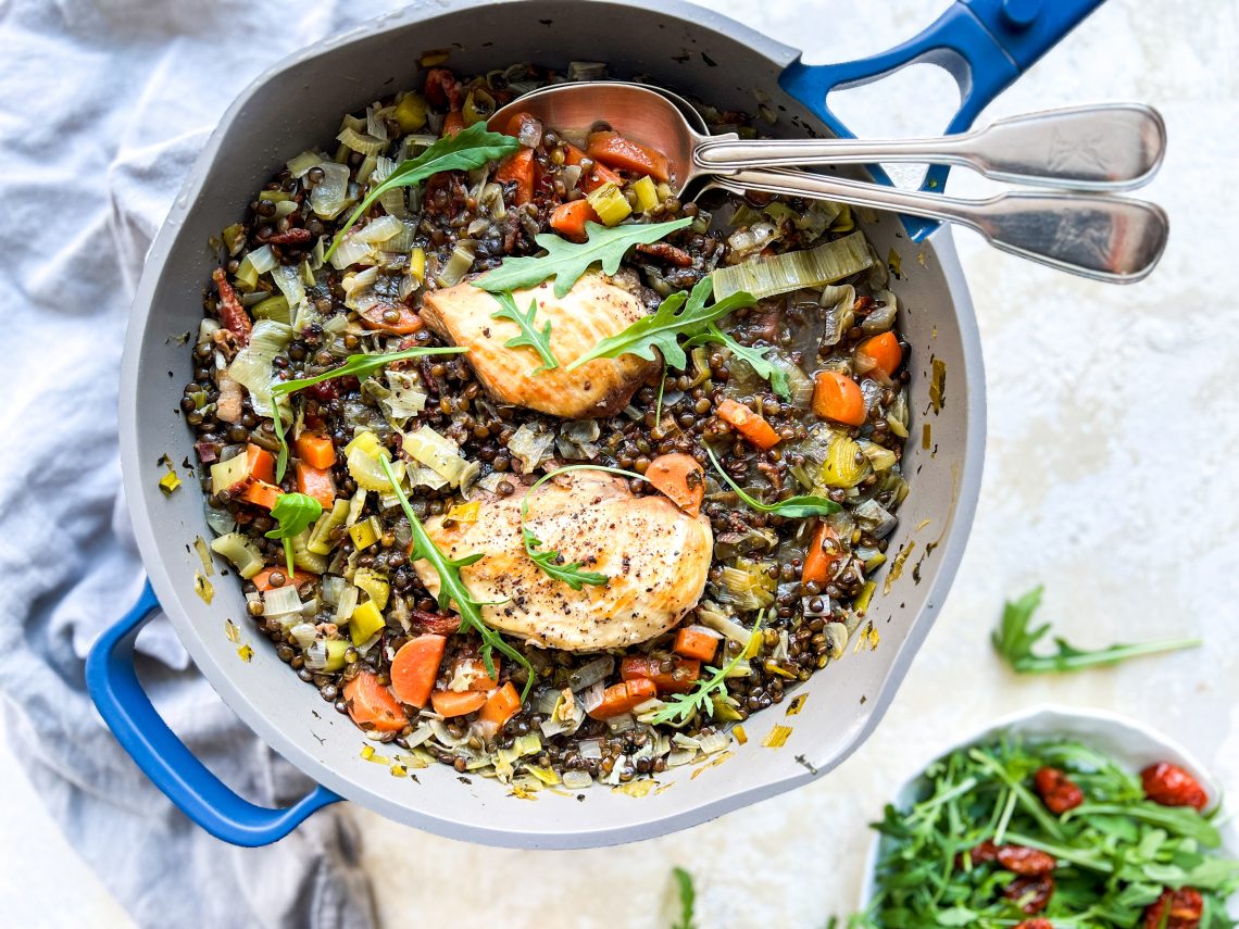 Photograph of One-Pan Chicken and Puy Lentils with Leek, Carrots, Fresh Herbs and Lemon