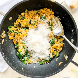 Photograph of One-pot Sweetcorn and Spinach Orzo with Garlic Butter and Black Pepper