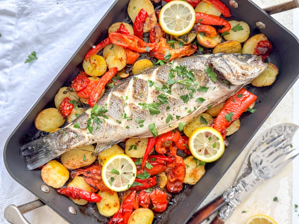 Photograph of Rick Stein's Baked Sea Bass with Roasted Red Peppers, Tomatoes, Anchovies and Potatoes