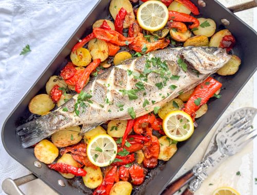 Photograph of Rick Stein's Baked Sea Bass with Roasted Red Peppers, Tomatoes, Anchovies and Potatoes