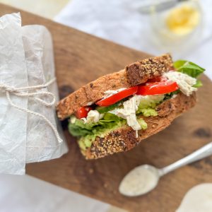 Photograph of Taid's Chicken Butty with Avocado, Lettuce, Tomato Cucumber and a Yoghurt, Mustard Dressing